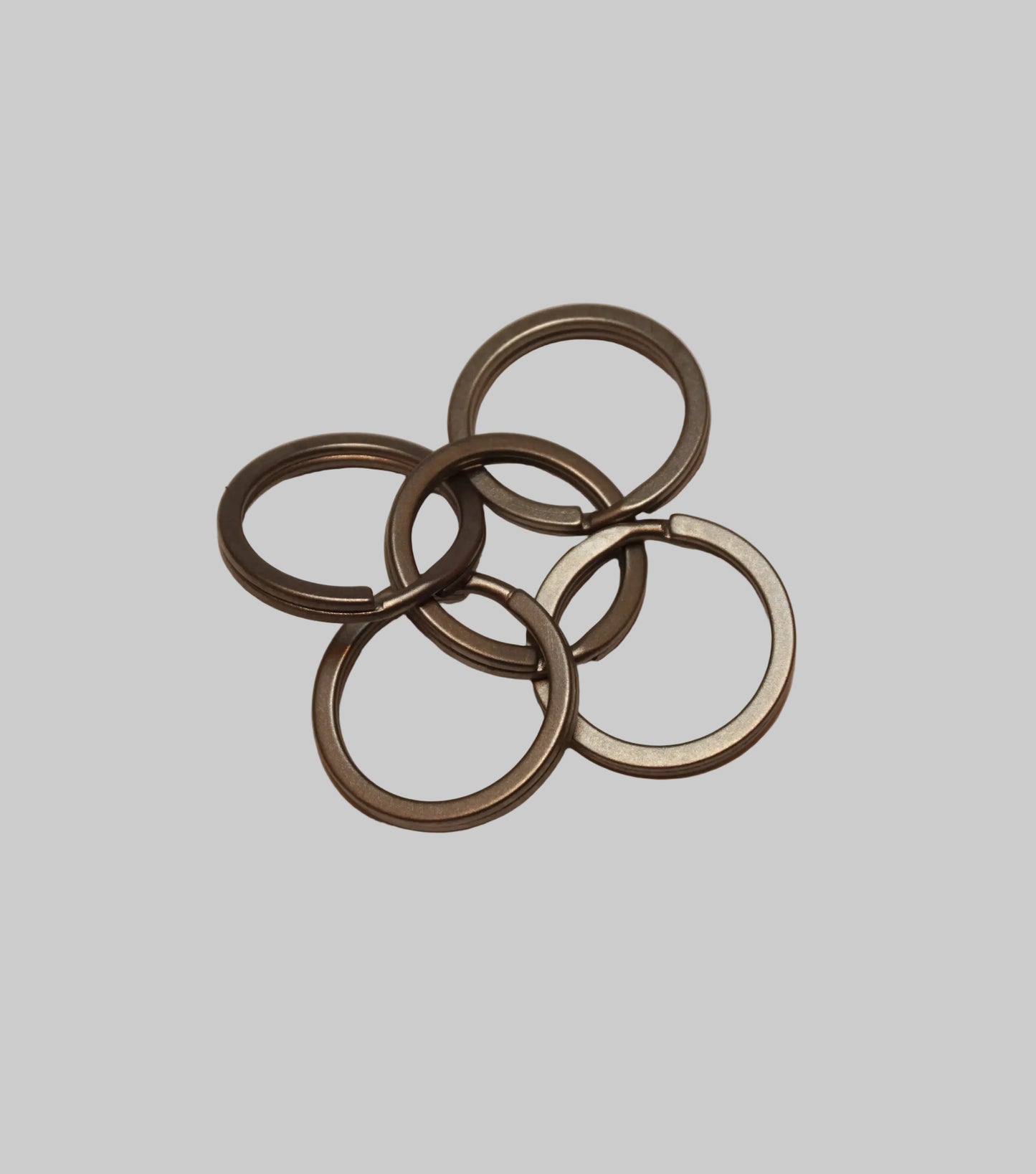 Set of metal rings on a beige background