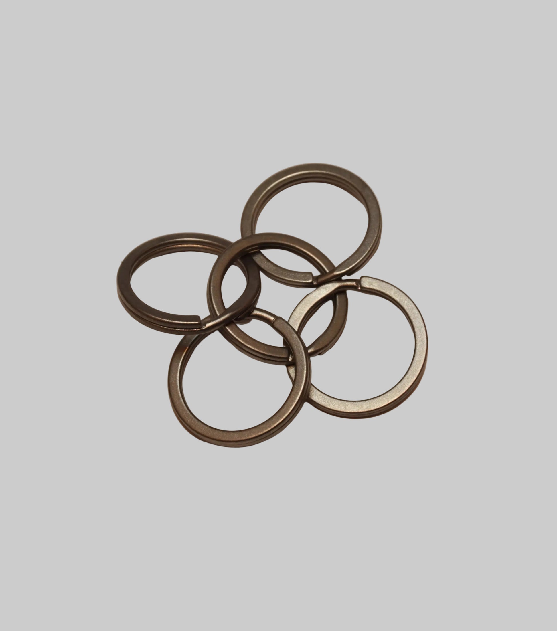 Set of metal rings on a beige background