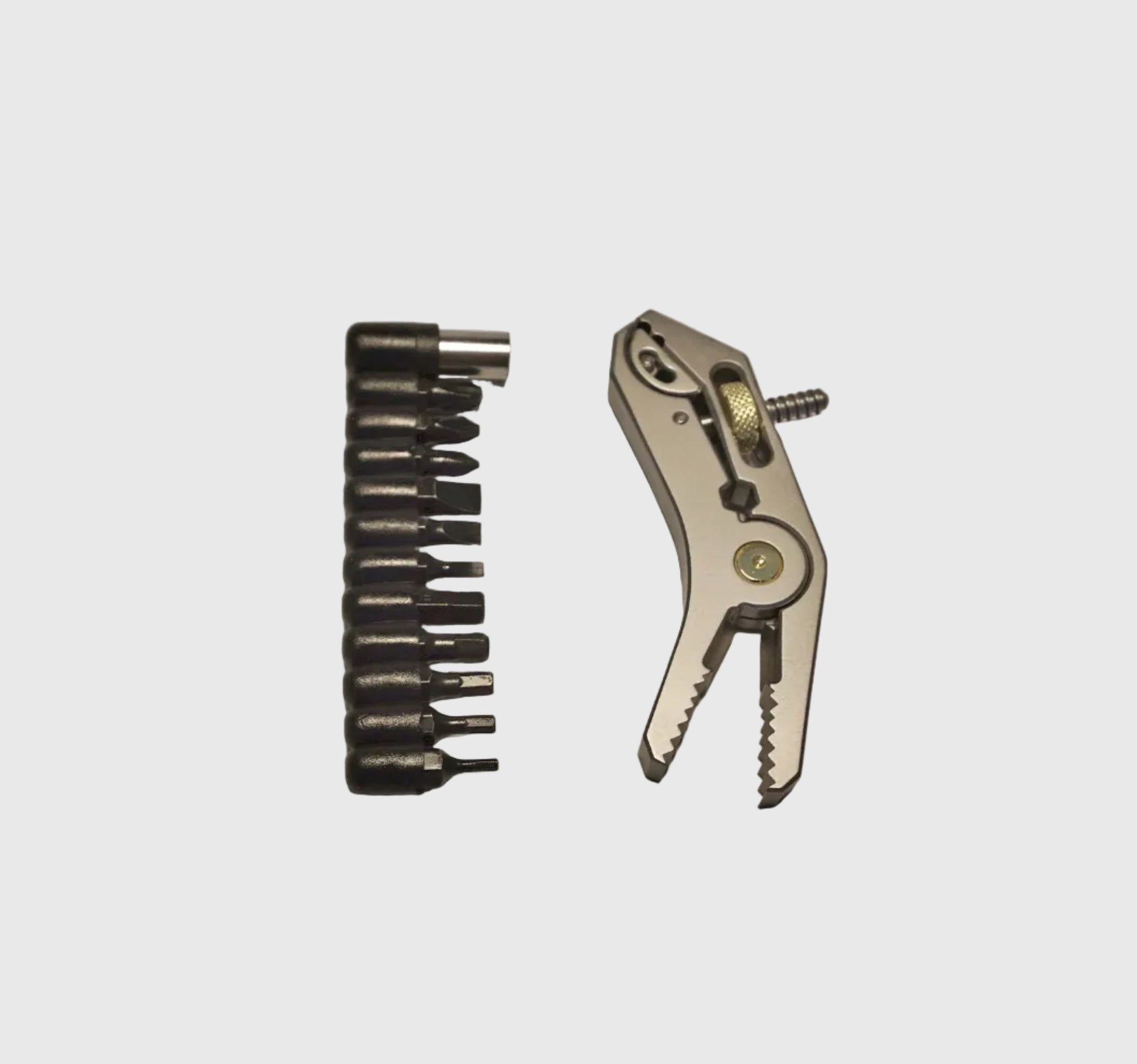 Set of drill bits and a plier on a light gray background