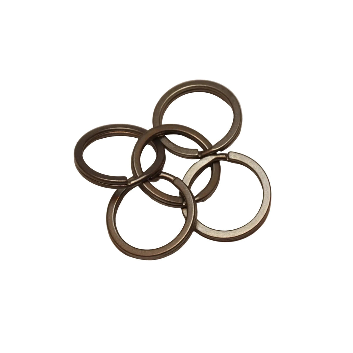 EDC Titanium Split Rings - Pack of 5 - Averx GearSet of metal rings on a beige backgroundAVERX Gear